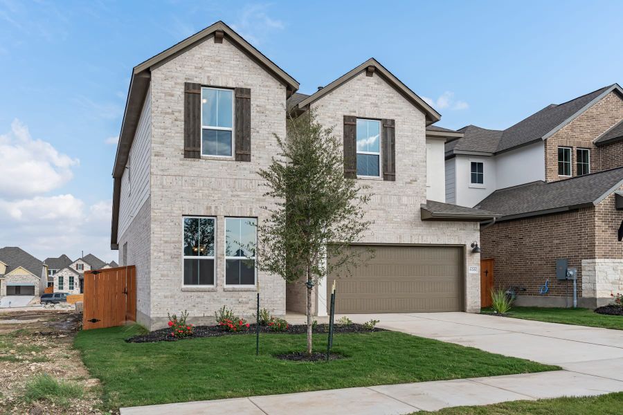 Front exterior of a new home in Lariat, Liberty Hill, TX, highlighting curb appeal (Image 23).