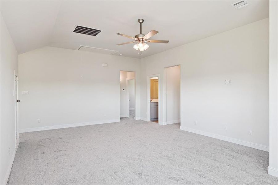 Unfurnished room with light carpet, lofted ceiling, and ceiling fan