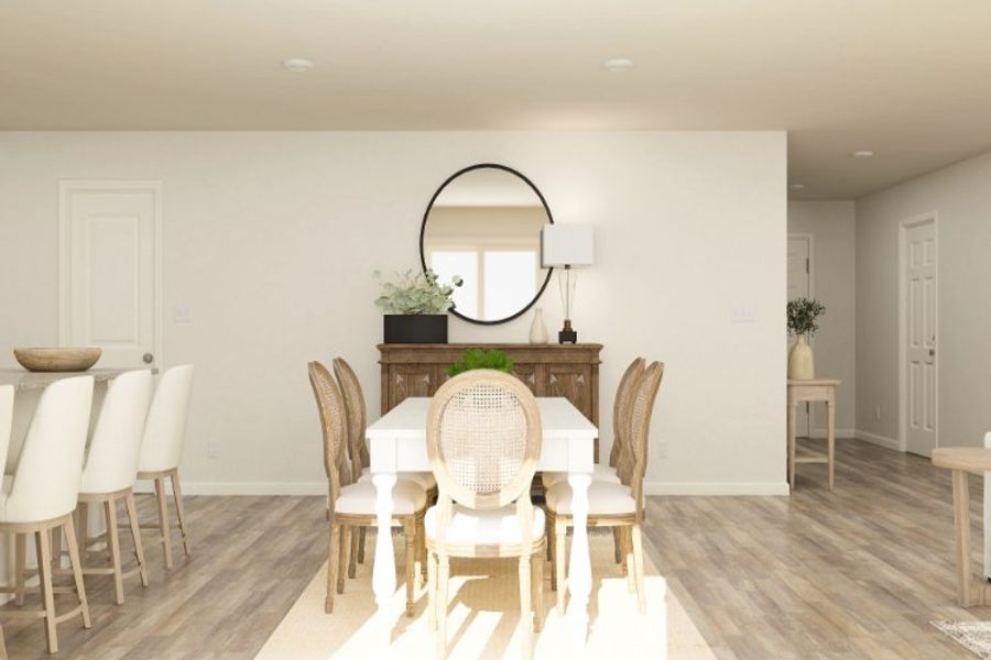 A dining room with a round table. A dining room with a round table.