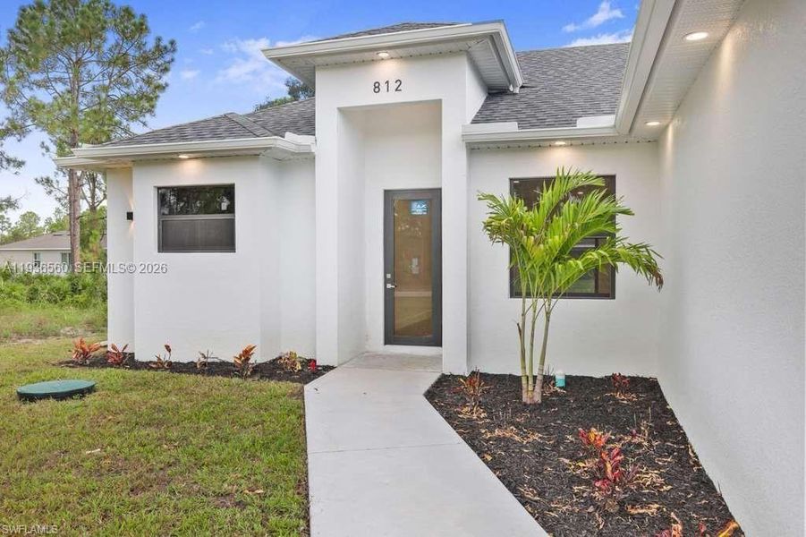 Exterior details and patio area of a home in , Lehigh Acres (Image 18). Exterior details and patio area of a home in , Lehigh Acres (Image 18).