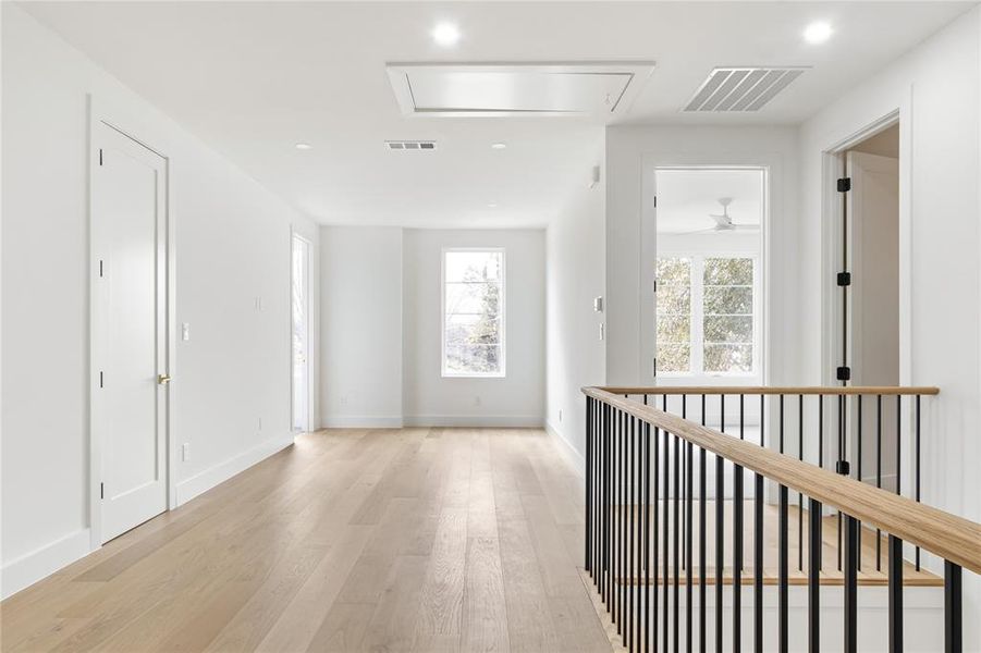 Hall with light hardwood / wood-style flooring