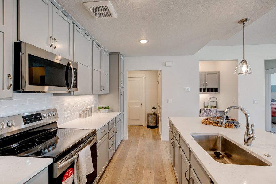 Representative furnished interior of a home built from the The Cambridge by Landmark Homes in The Lakes at Centerra, Loveland (Image 13).