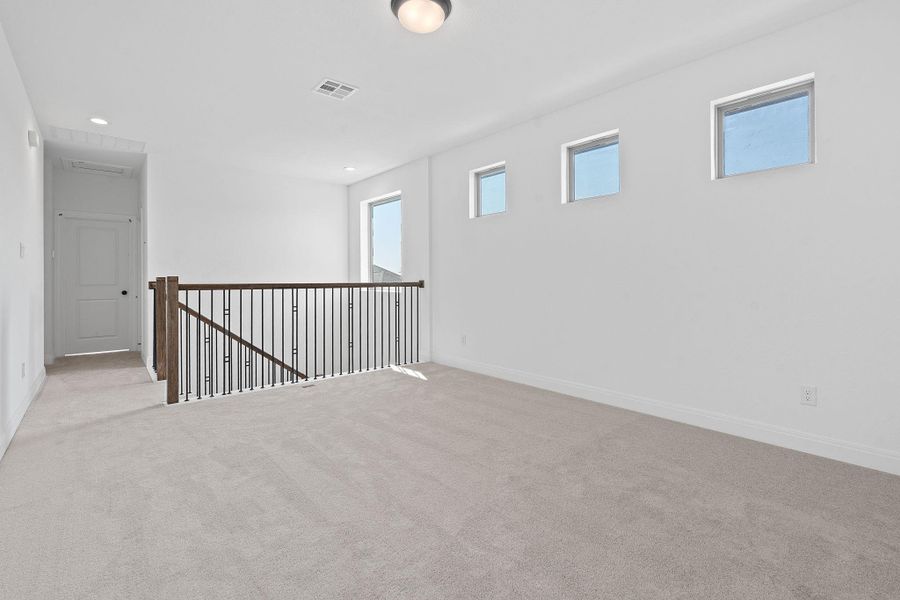 Carpeted spare room with recessed lighting Carpeted spare room with recessed lighting