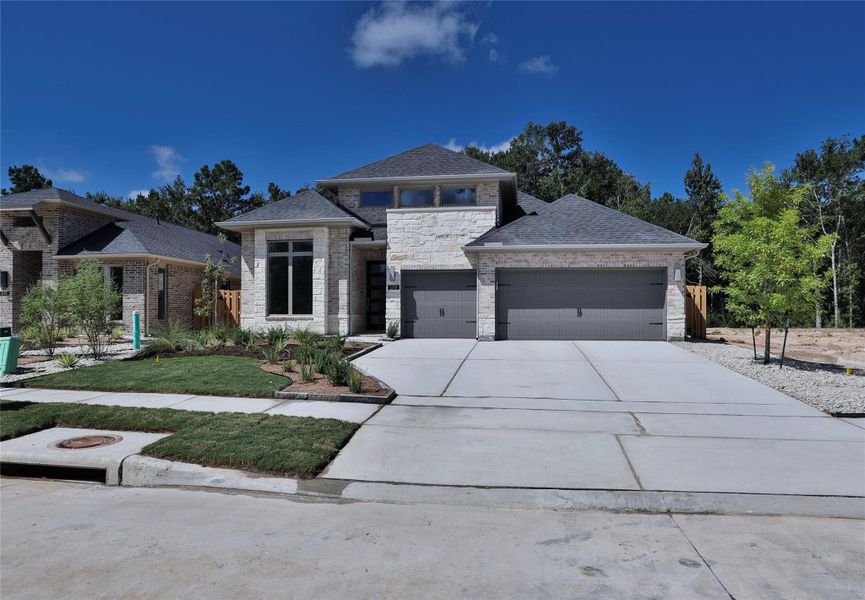 Front exterior of a new home in , Montgomery, TX, highlighting curb appeal (Image 2).