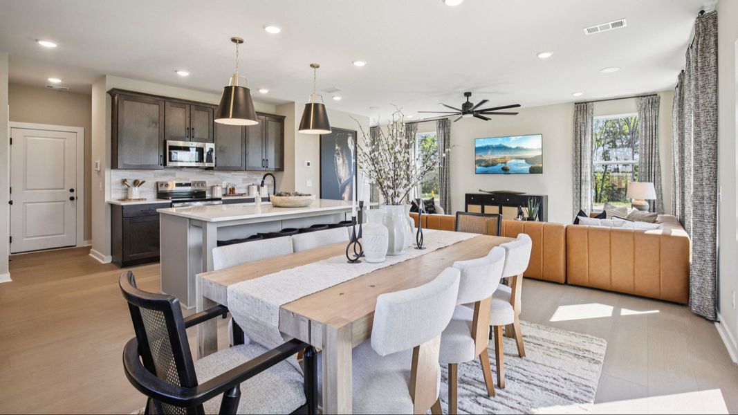 Full view of first floor living room, kitchen, and dining area