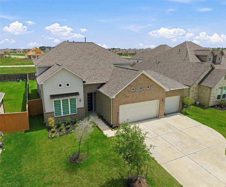 Front exterior of a new home in Sierra Vista, Iowa Colony, TX, highlighting curb appeal (Image 22).