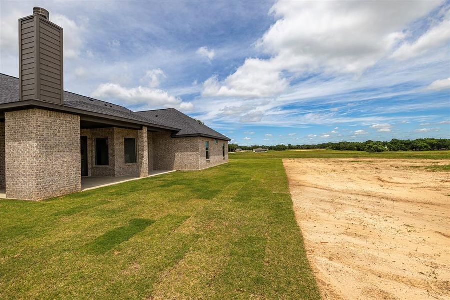 Exterior details and patio area of a home in Prairie Winds Estates, Poolville (Image 29).