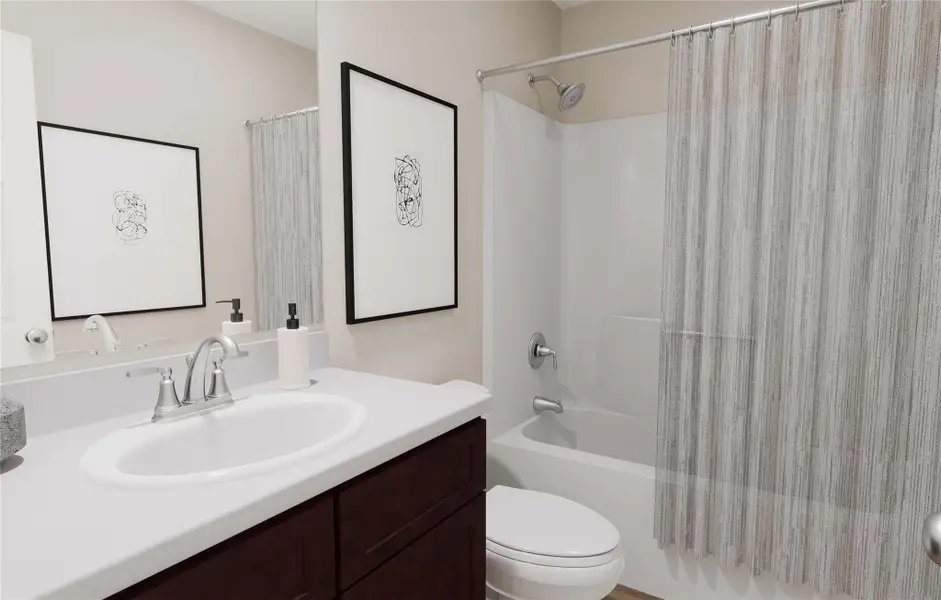 Bathroom featuring shower / bath combo with shower curtain, toilet, and vanity Bathroom featuring shower / bath combo with shower curtain, toilet, and vanity