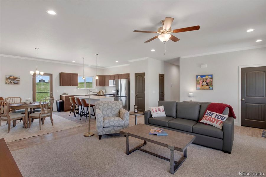 View of front of home featuring stone siding, an attached garage, board and batten siding, and concrete driveway