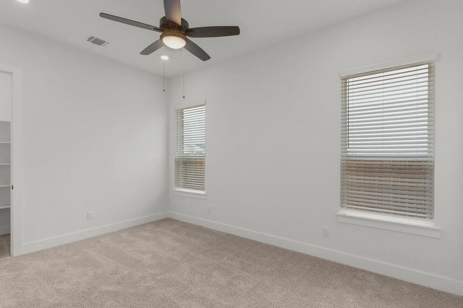 Representative unfurnished interior of a home built from the Drios by Chesmar Homes in Berry Creek Highlands, Georgetown (Image 27).