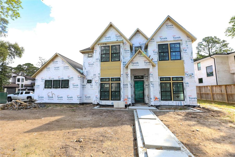 Home will be brick exterior with cast stone at front entrance. Walkway will be bricked as well with designer landscaping at front entry. *Construction Progress Photo taken 3/25/26*