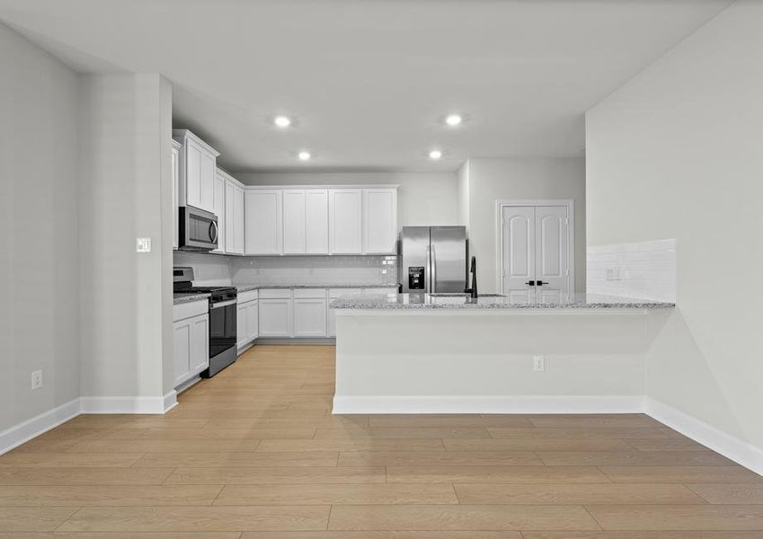 The kitchen of the Willow has granite countertops.