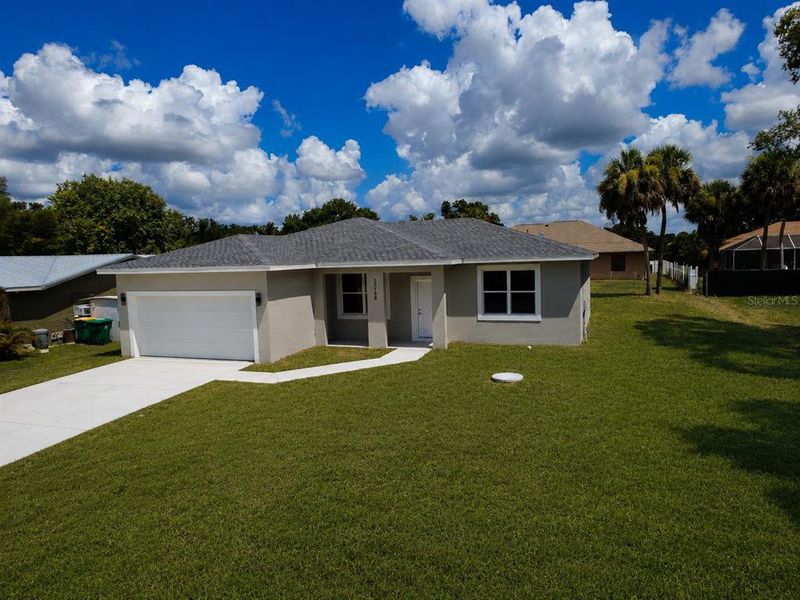 Front exterior of a new home in , Port Charlotte, FL, highlighting curb appeal (Image 1). Front exterior of a new home in , Port Charlotte, FL, highlighting curb appeal (Image 1).