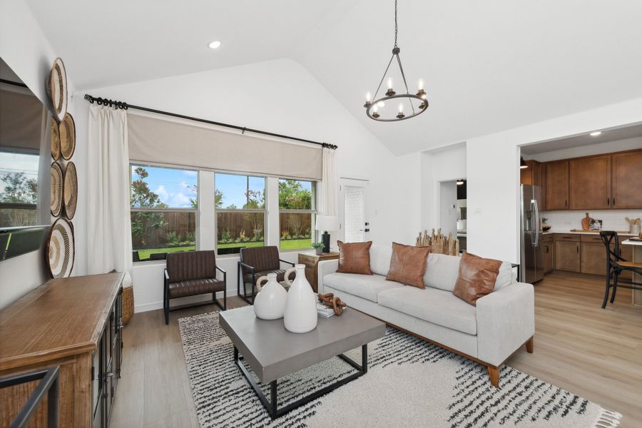 Great room with vaulted ceilings and chandelier