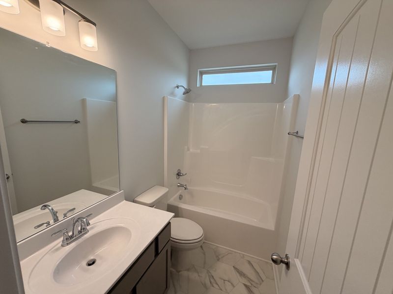 Bathroom #2 with the easy clean vinyl flooring and fiberglass tub-shower combo!