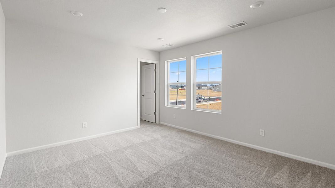 Spacious, unfurnished interior of a new home in The Legacy Collection at Talon Pointe, Thornton (Image 9).