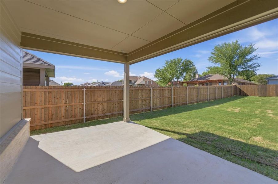 Fenced backyard featuring a patio area