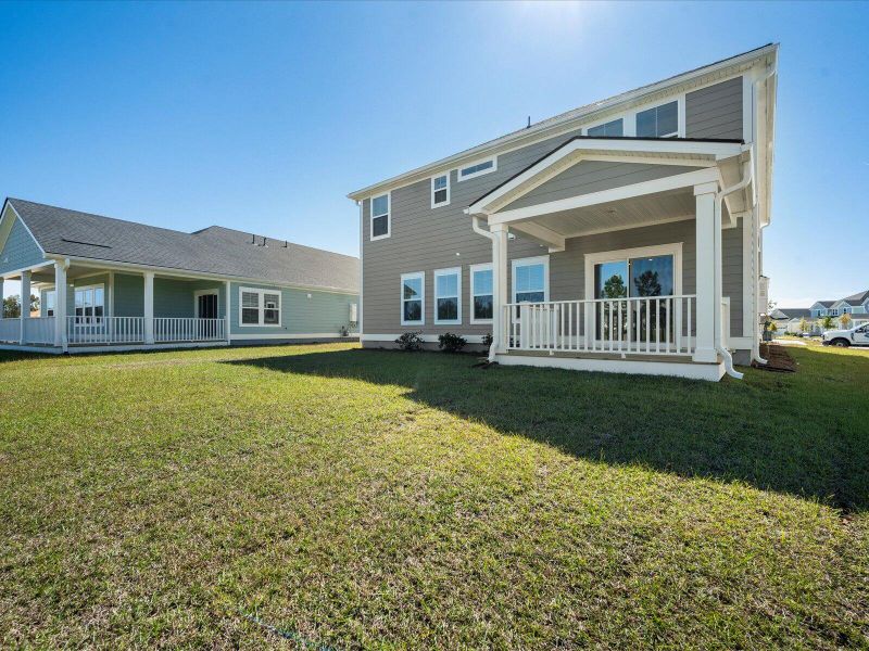 Exterior details and patio area of a home in The Coves at Lakes of Cane Bay, Summerville (Image 4).
