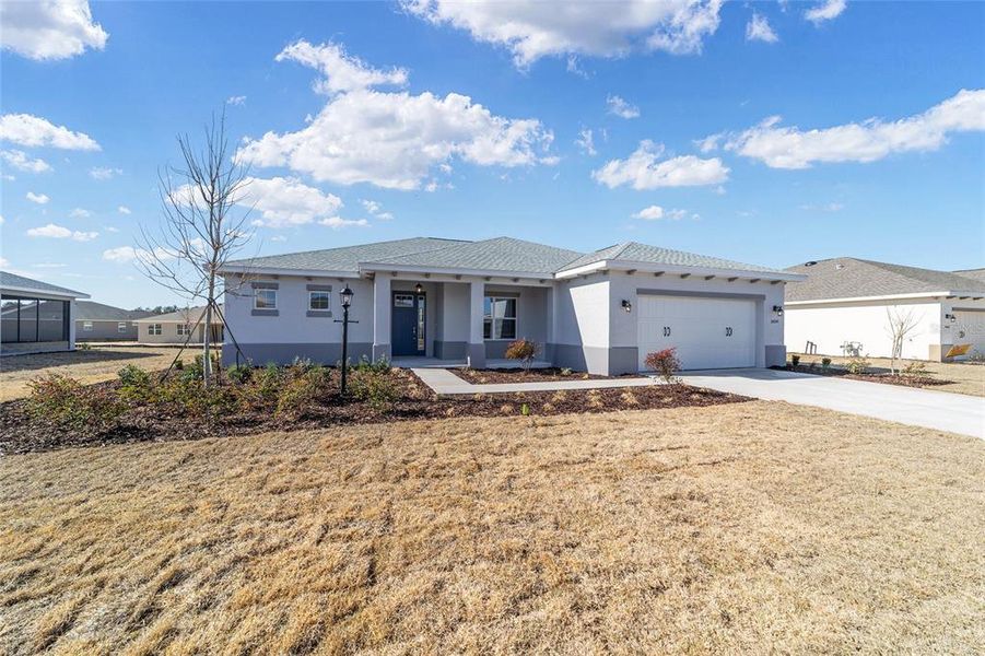 Front exterior of a new home in On Top of the World Communities, Ocala, FL, highlighting curb appeal (Image 20).