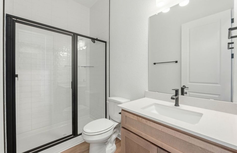 Furnished interior view inside a new home in 6 Creeks, Kyle (Image 9).