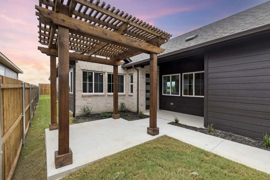 Exterior details and patio area of a home in Keeneland, Aubrey (Image 3).