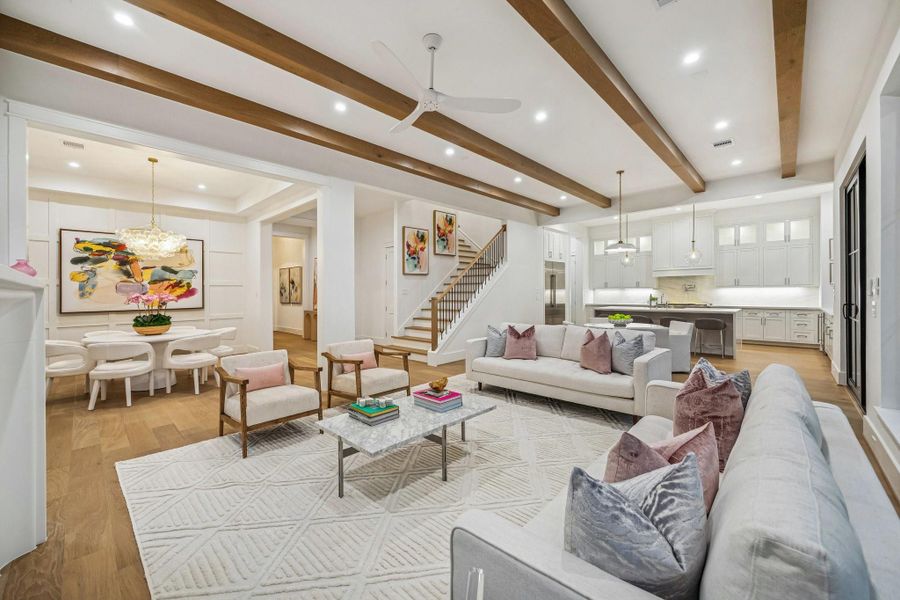 View from the Family Room towards the Kitchen and Staircase. The staircase also has oak treads on all stairs, transitional iron balusters, wood handrails and newel posts.