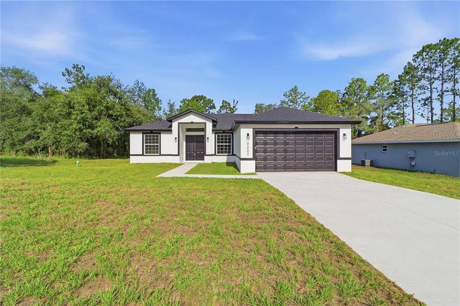 Front exterior of a new home in , Citrus Springs, FL, highlighting curb appeal (Image 21). Front exterior of a new home in , Citrus Springs, FL, highlighting curb appeal (Image 21).