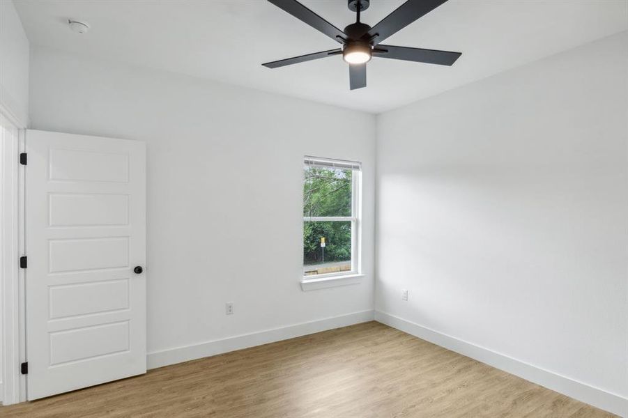 Spare room with ceiling fan and light hardwood / wood-style flooring