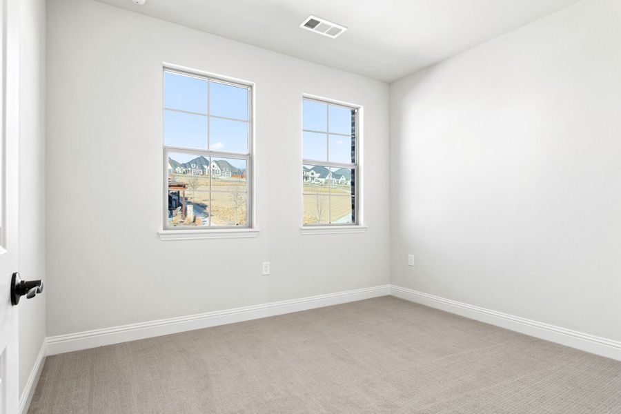 Spacious, unfurnished interior of a new home in The Tribute, The Colony (Image 40).