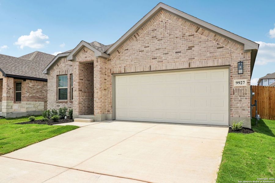 Front exterior of a new home in Kallison Ranch, San Antonio, TX, highlighting curb appeal (Image 24). Front exterior of a new home in Kallison Ranch, San Antonio, TX, highlighting curb appeal (Image 24).