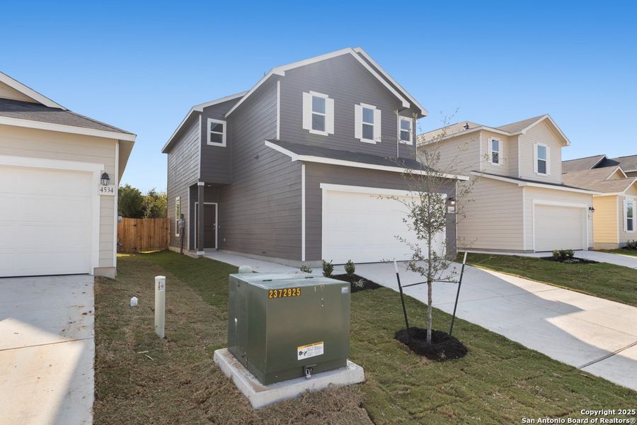 Front exterior of a new home in Spanish Trails Villas, San Antonio, TX, highlighting curb appeal (Image 10).