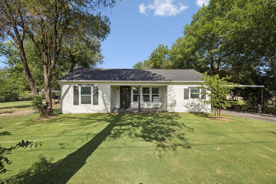 Front exterior of a new home in , Weatherford, TX, highlighting curb appeal (Image 1).