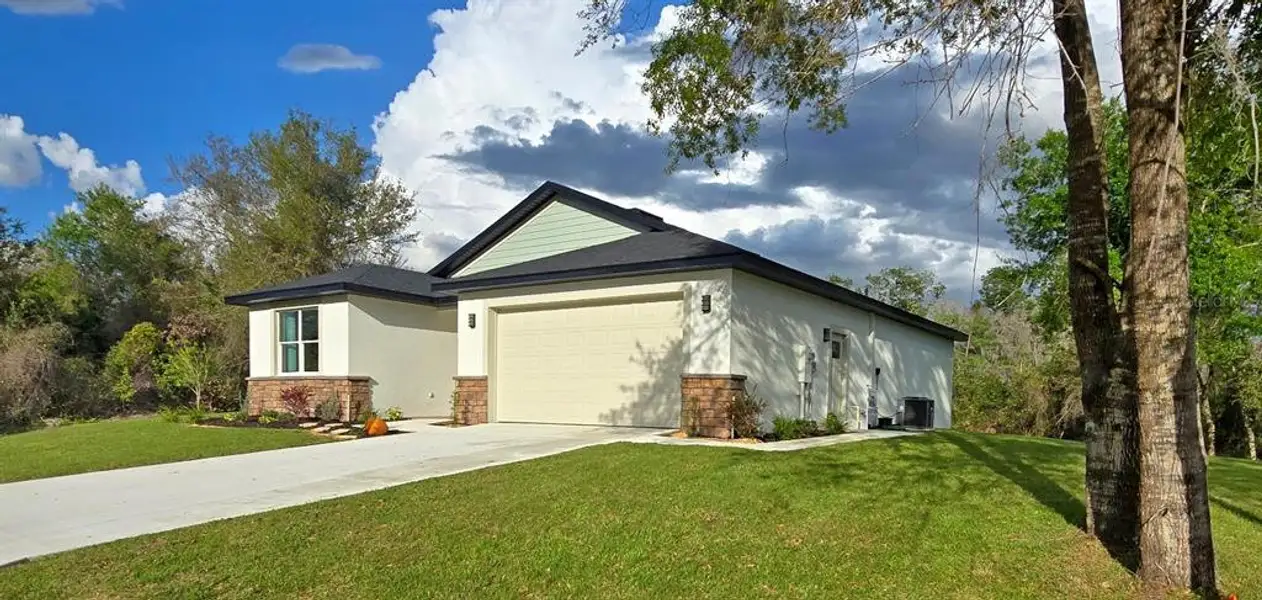 Front exterior of a new home in , Sebring, FL, highlighting curb appeal (Image 1). Front exterior of a new home in , Sebring, FL, highlighting curb appeal (Image 1).