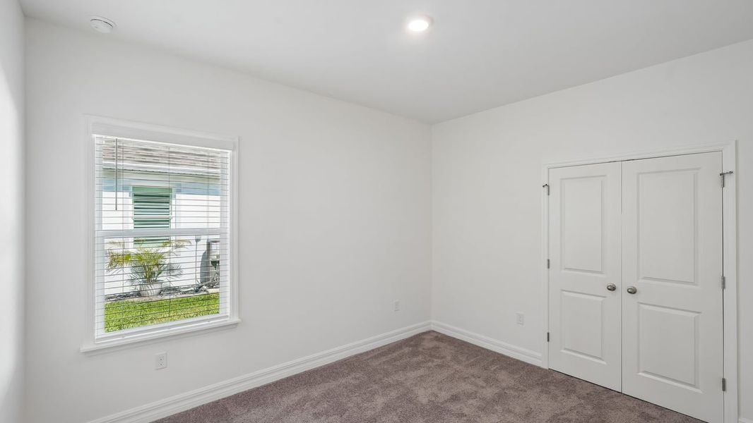 Spacious, unfurnished interior of a new home in Heritage Station, Punta Gorda (Image 43).