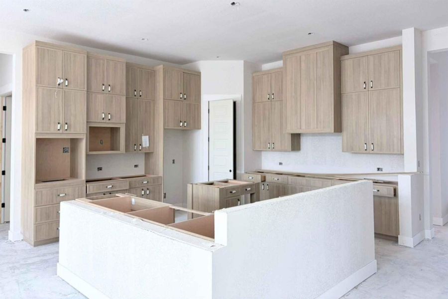 Kitchen featuring a center island and light brown cabinets