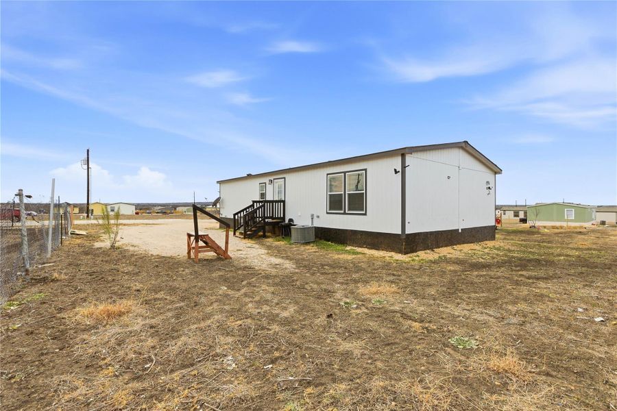 A well-maintained single-story dwelling offers simple desert living with an inviting porch entry.