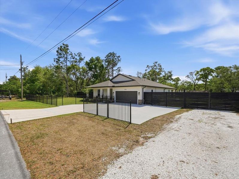 Front exterior of a new home in , Spring Hill, FL, highlighting curb appeal (Image 21).