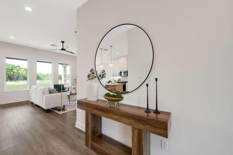 Hall with dark wood-type flooring and recessed lighting Hall with dark wood-type flooring and recessed lighting