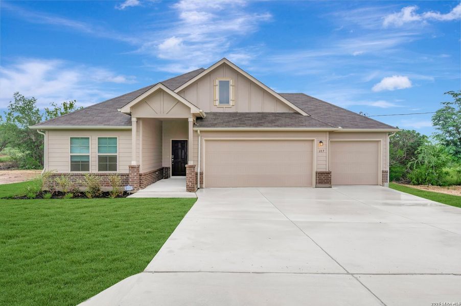 Front exterior of a new home in Chaparral Ranch, Floresville, TX, highlighting curb appeal (Image 1). Front exterior of a new home in Chaparral Ranch, Floresville, TX, highlighting curb appeal (Image 1).