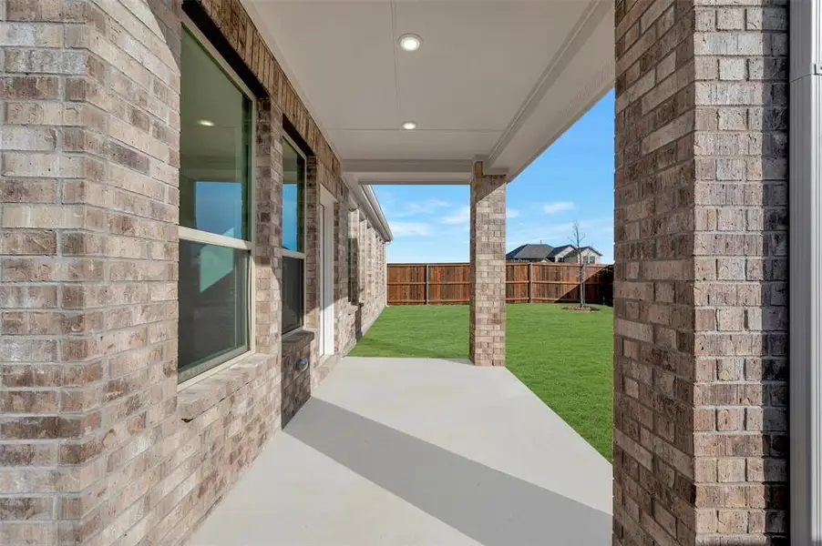 Exterior details and patio area of a home in Lily Creek at Sutton Fields, Aubrey (Image 4).