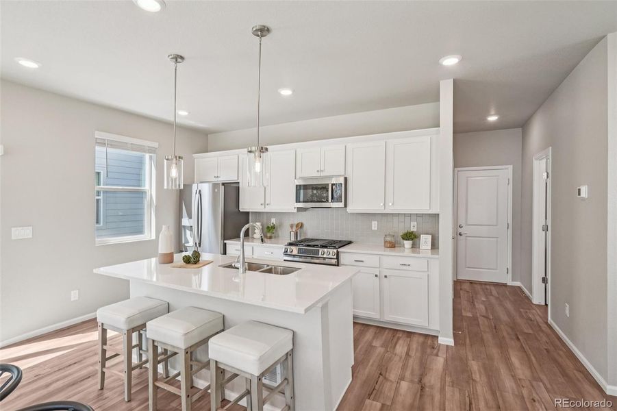 Furnished interior view inside a new home in Woodrose at Painted Prairie, Aurora (Image 4).