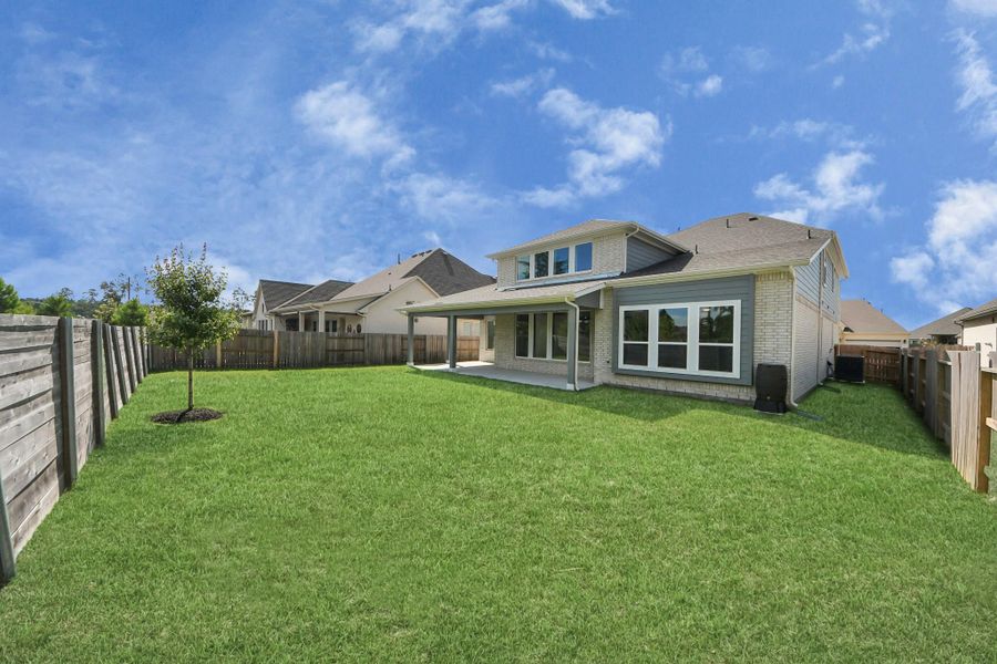 Front exterior of a new home in ARTAVIA: Hilltop Collection, Conroe, TX, highlighting curb appeal (Image 1). Front exterior of a new home in ARTAVIA: Hilltop Collection, Conroe, TX, highlighting curb appeal (Image 1).