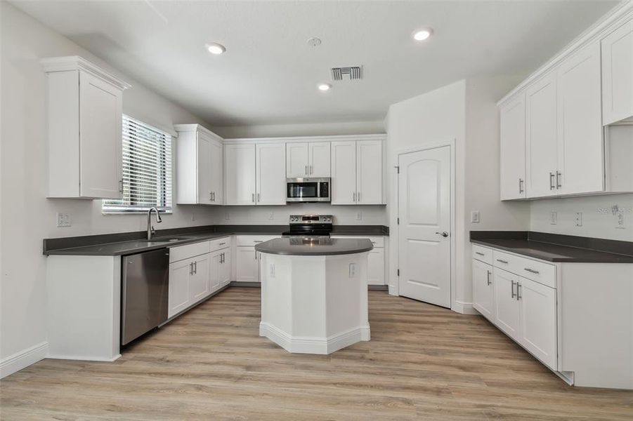 Photos are not the home listed, but same floor plan.