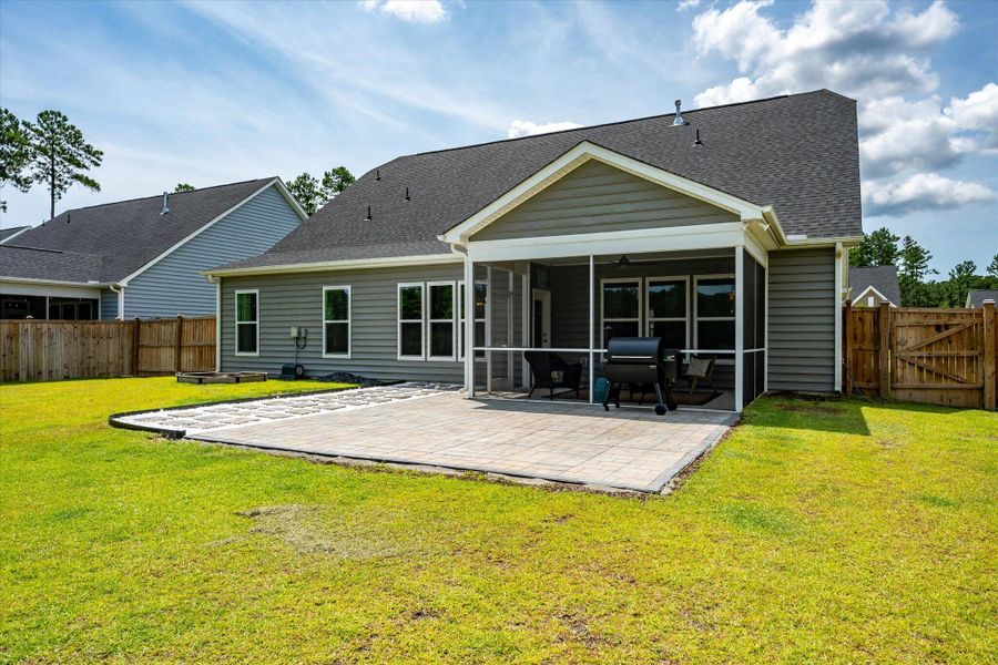 Exterior details and patio area of a home in The Enclave at French Quarter Creek, Huger (Image 26).