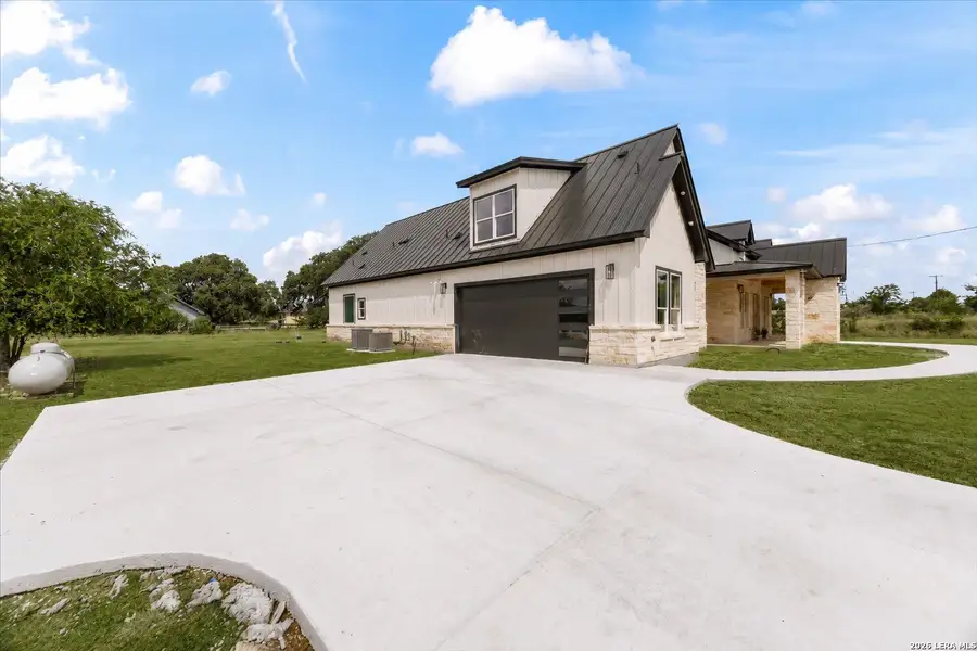 Front exterior of a new home in , Bandera, TX, highlighting curb appeal (Image 1). Front exterior of a new home in , Bandera, TX, highlighting curb appeal (Image 1).