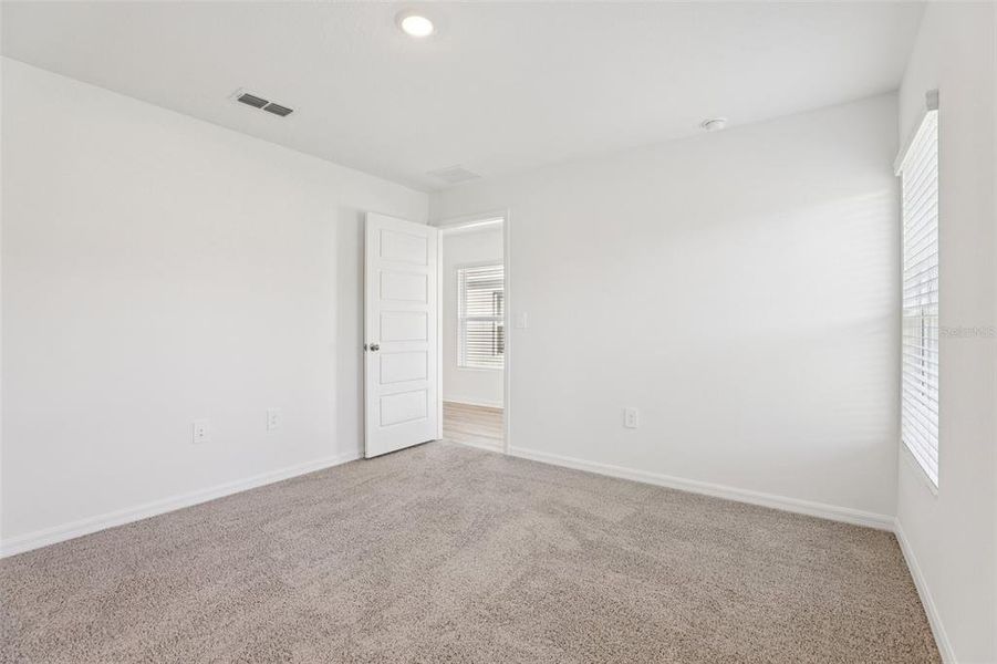 Spacious, unfurnished interior of a new home in Villamar, Winter Haven (Image 22).