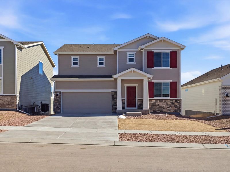 Front exterior of a new home in Meridian Ranch, Peyton, CO, highlighting curb appeal (Image 19).