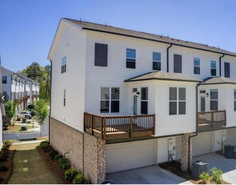 Front exterior of a new home in Waterside Townhomes, Peachtree Corners, GA, highlighting curb appeal (Image 18).