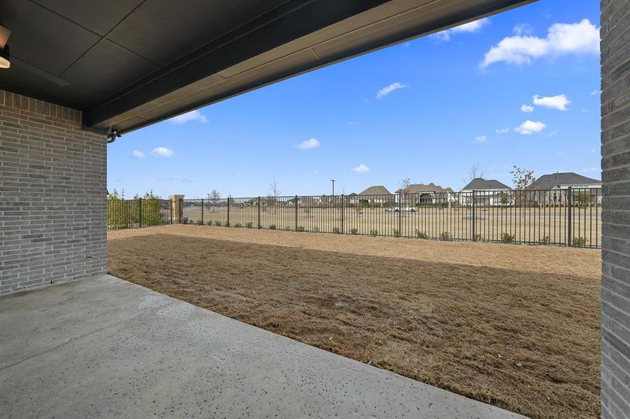 Exterior details and patio area of a home in Quail Hollow, Rockwall (Image 4).