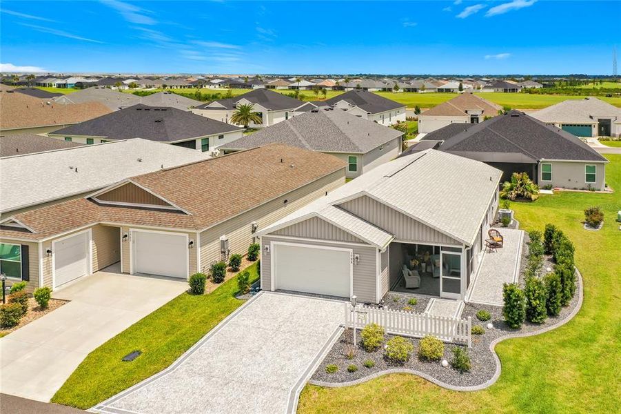 Front exterior of a new home in , The Villages, FL, highlighting curb appeal (Image 24).